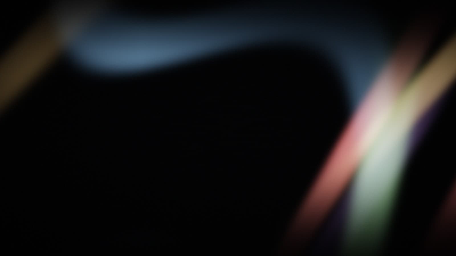 Two currents of refracted light curving past each other in darkness.