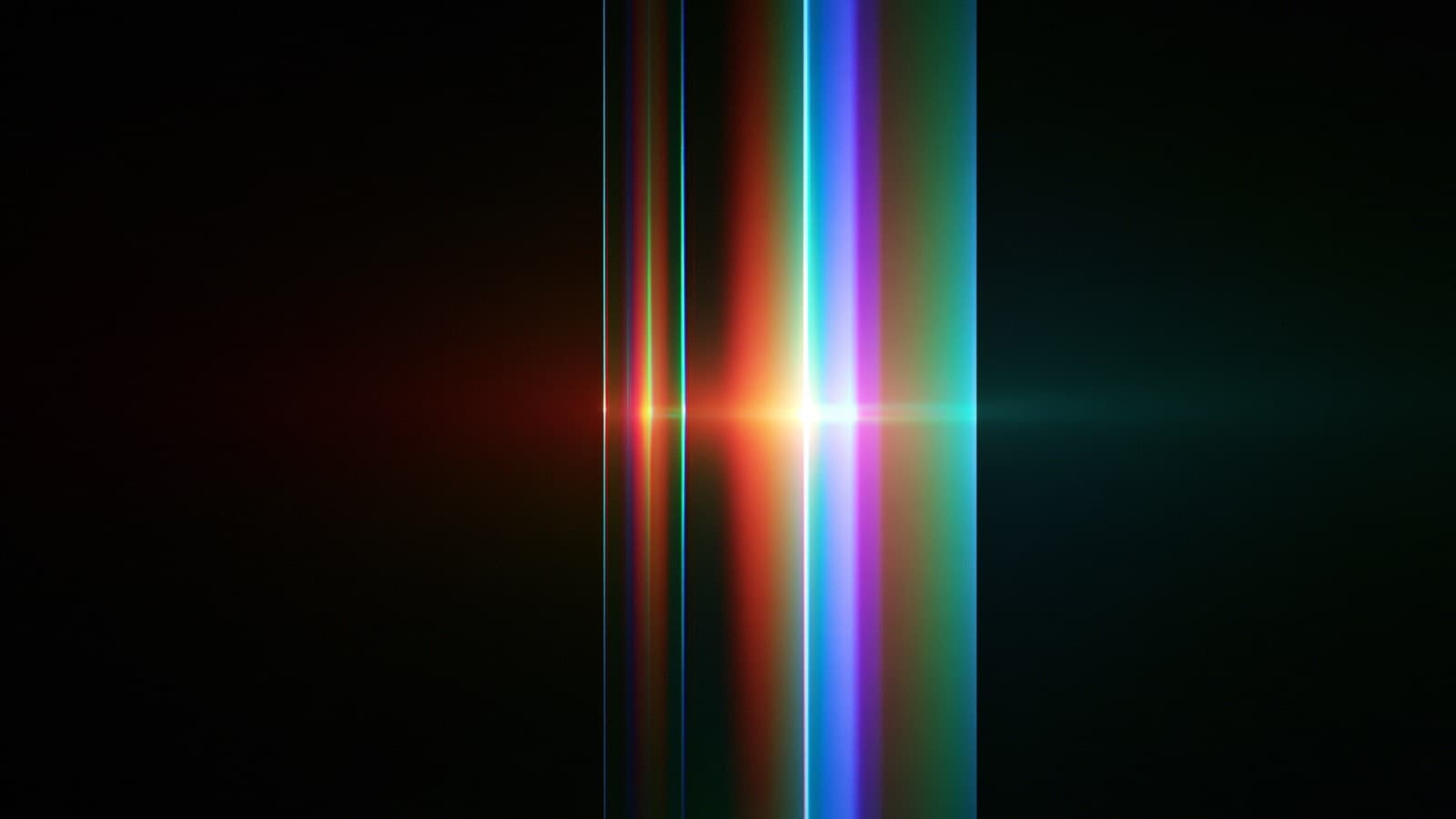A tall prism resolving one white core into ordered bands of colour.